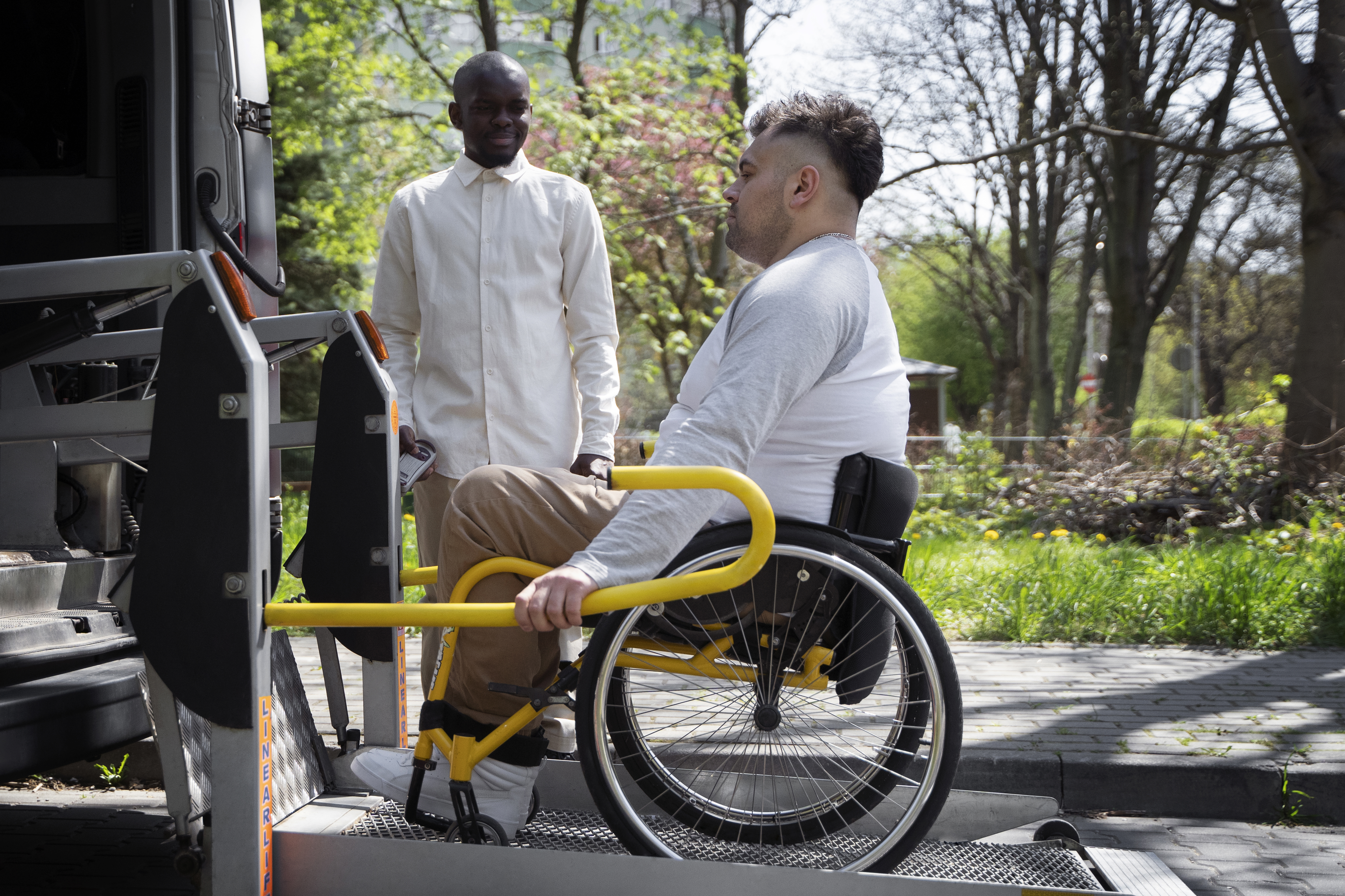 full-shot-disabled-man-getting-out-vehicle